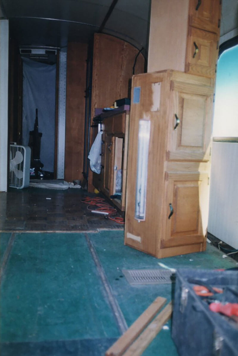 Preparation to hang the hardwood cabinets.