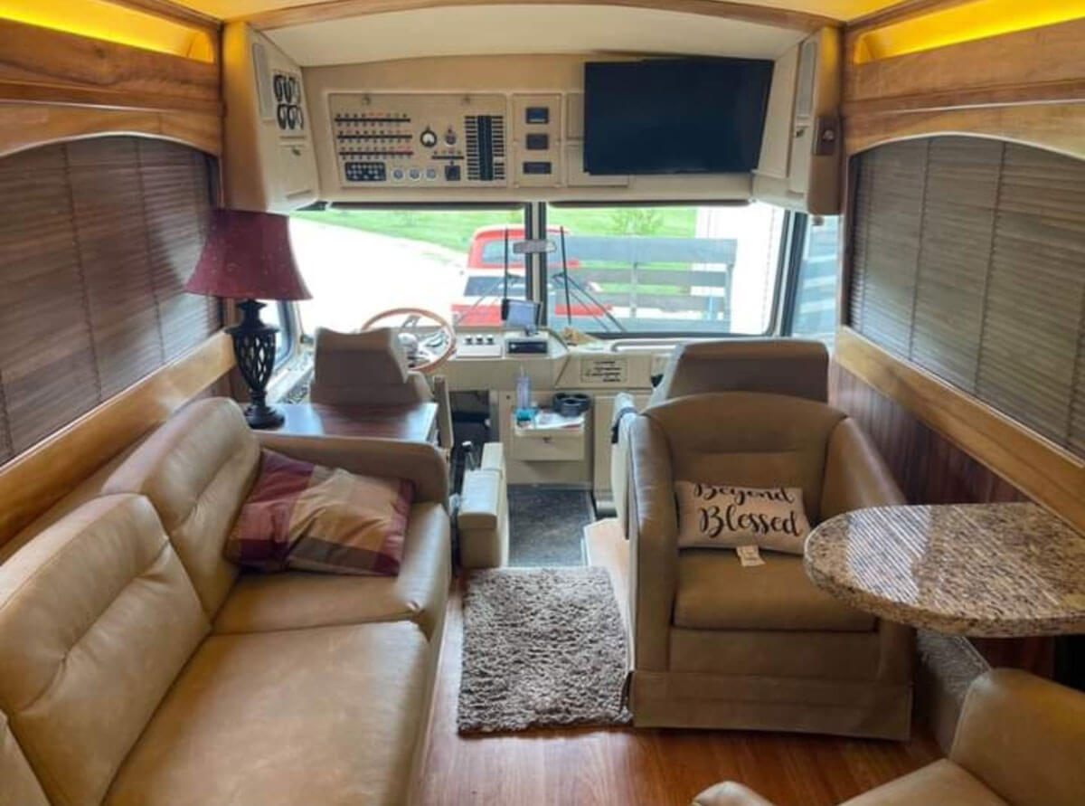 This image has an empty alt attribute; its file name is Driver-and-lounge-area.-The-couch-and-chairs-have-been-reupholstered.-This-is-a-great-area-to-visit-in.-N.jpg