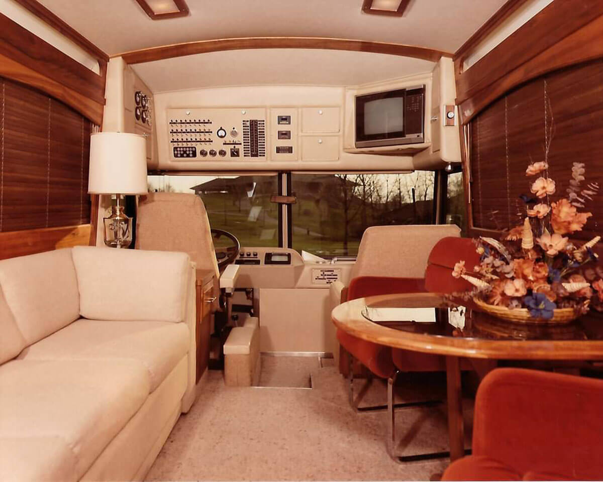 This image has an empty alt attribute; its file name is Original-bus-interior-looking-from-the-back-to-the-front.jpg