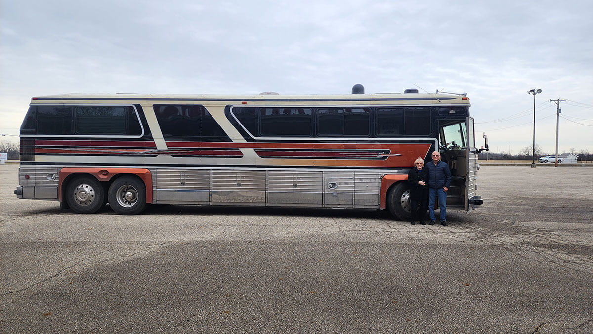 This image has an empty alt attribute; its file name is Walter-and-his-lovely-wife-Patricia-with-the-bus-at-Dayton-Airfield.jpg