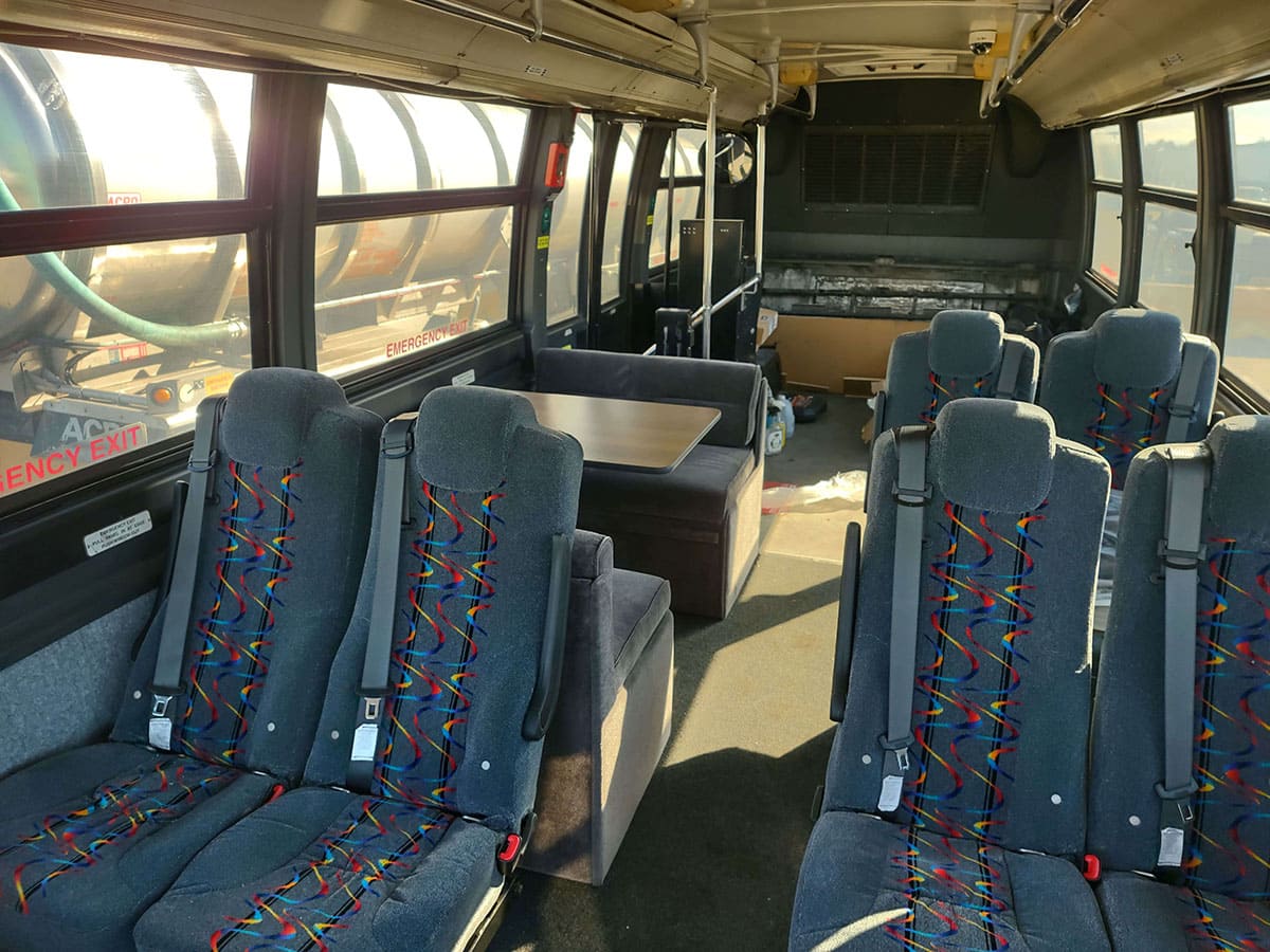 Looking rearward: seats, table, and carpeting installed.