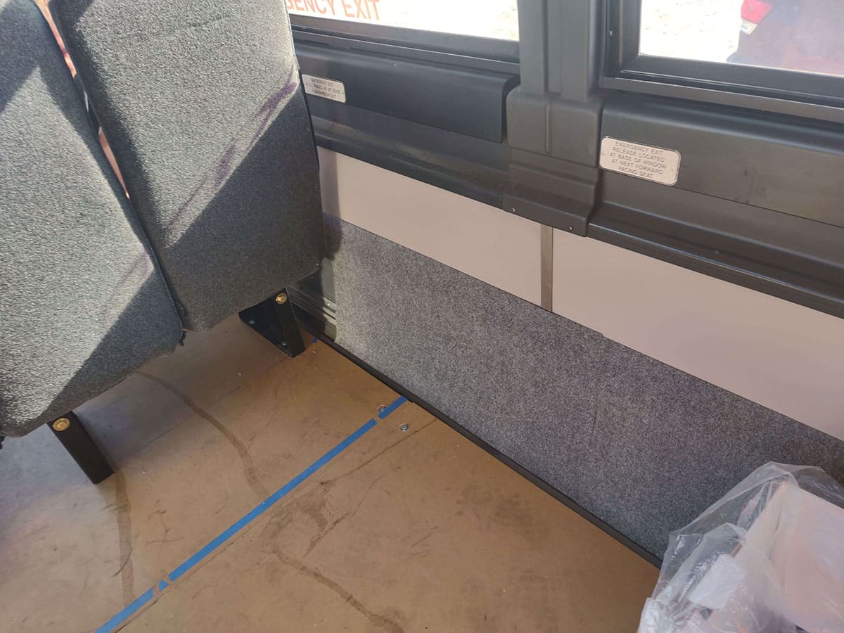 Installing the carpet.