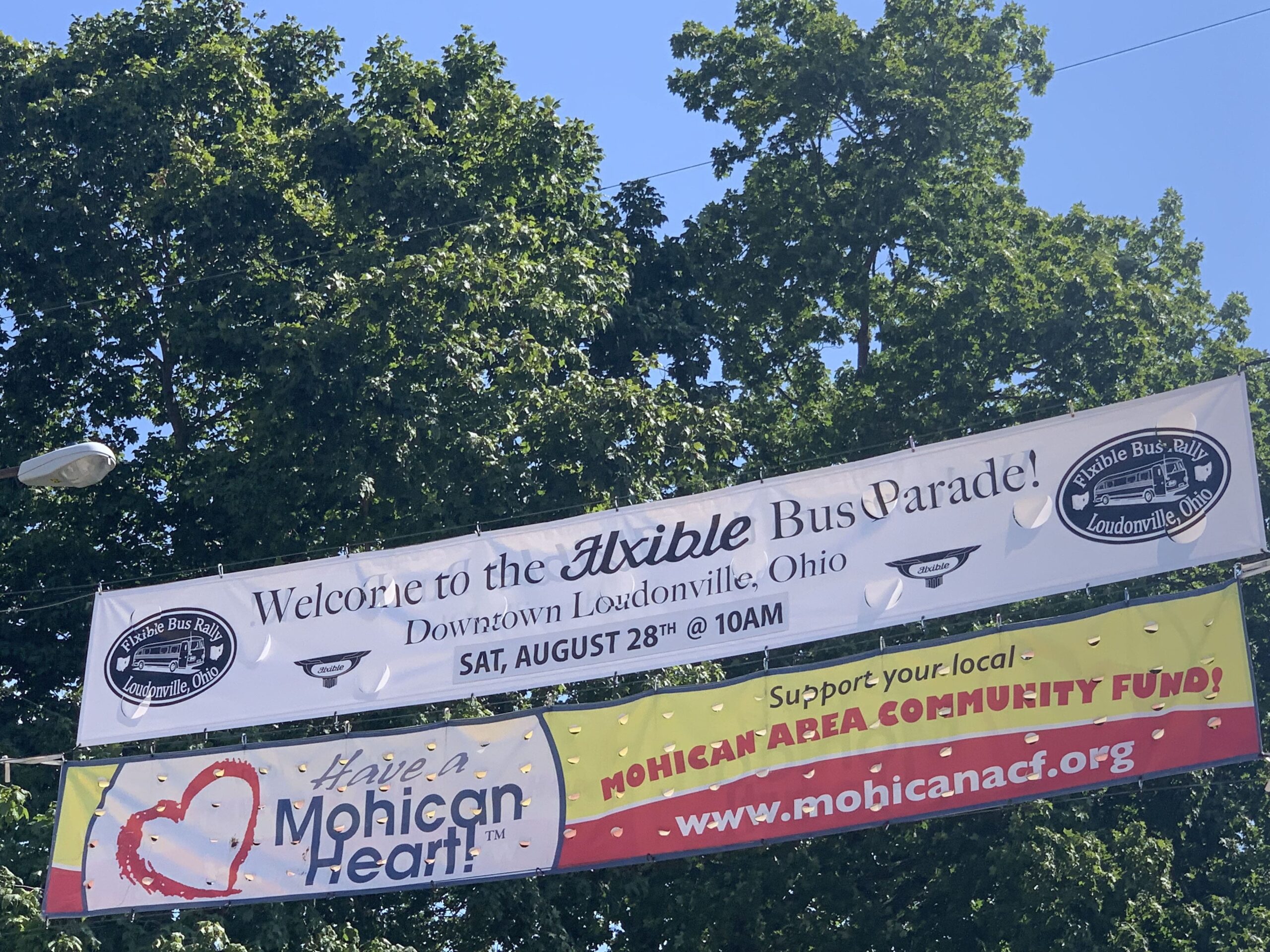 Banner welcoming the Flxible buses to town.