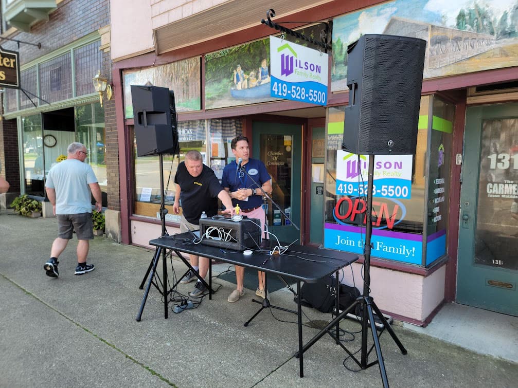 DJ and Brian Santin downtown making announcements.