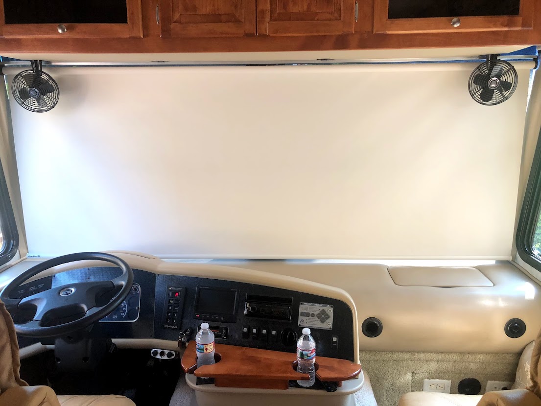 Windshield Shield.  Windshields let in a lot of heat as they cannot be tinted like side windows can. 