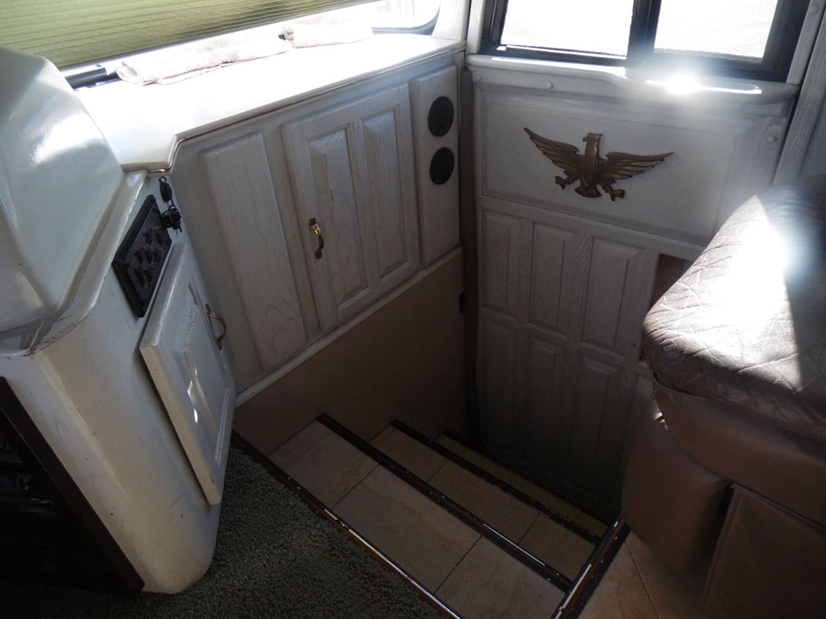 The floor is shown retracted to enter and exit the coach.